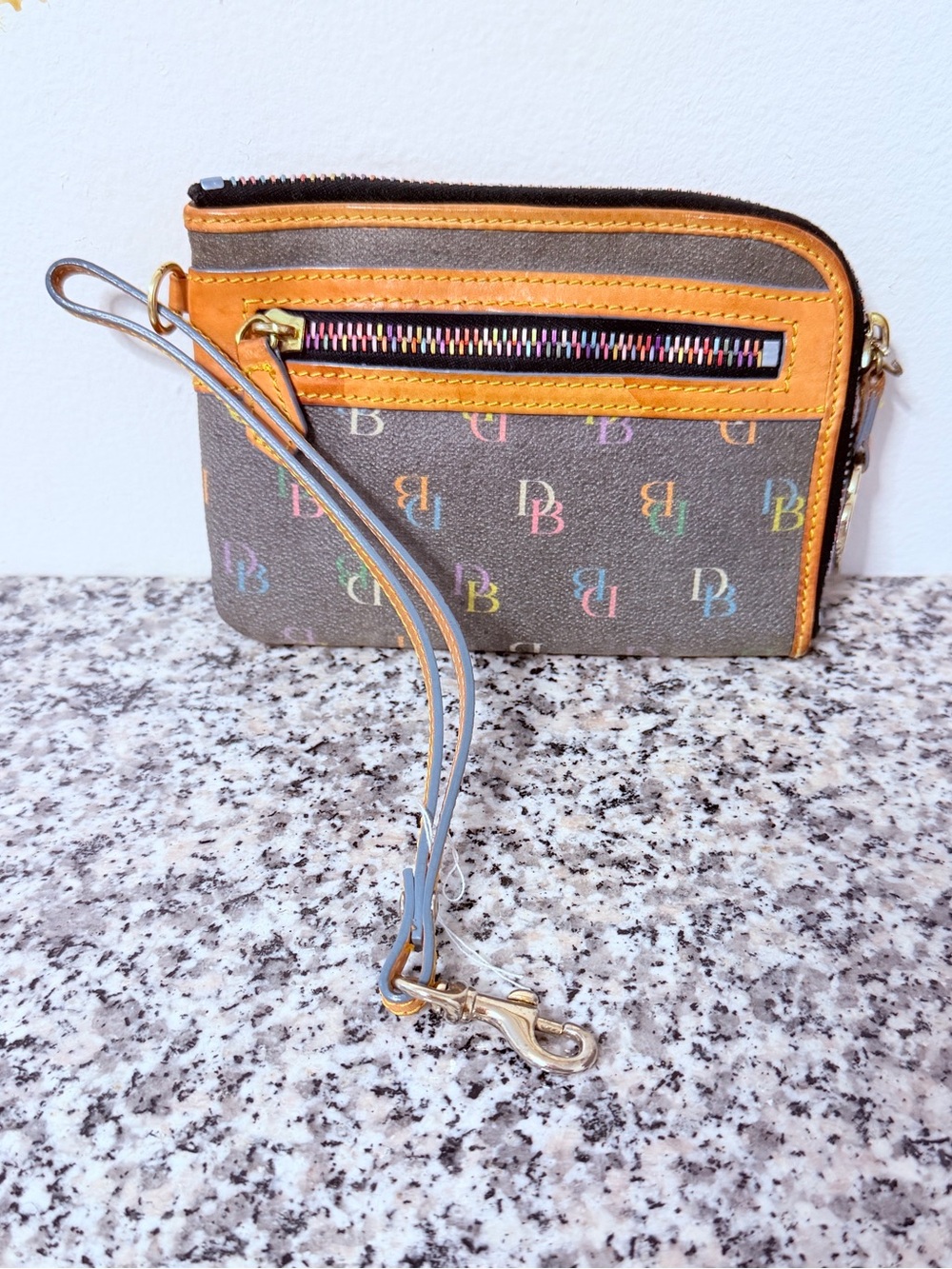 Dooney & Bourke Brown Wristlet with Orange Trim and Multicolor Logo